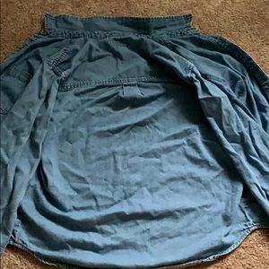 A light blue jean bottoms up shirt